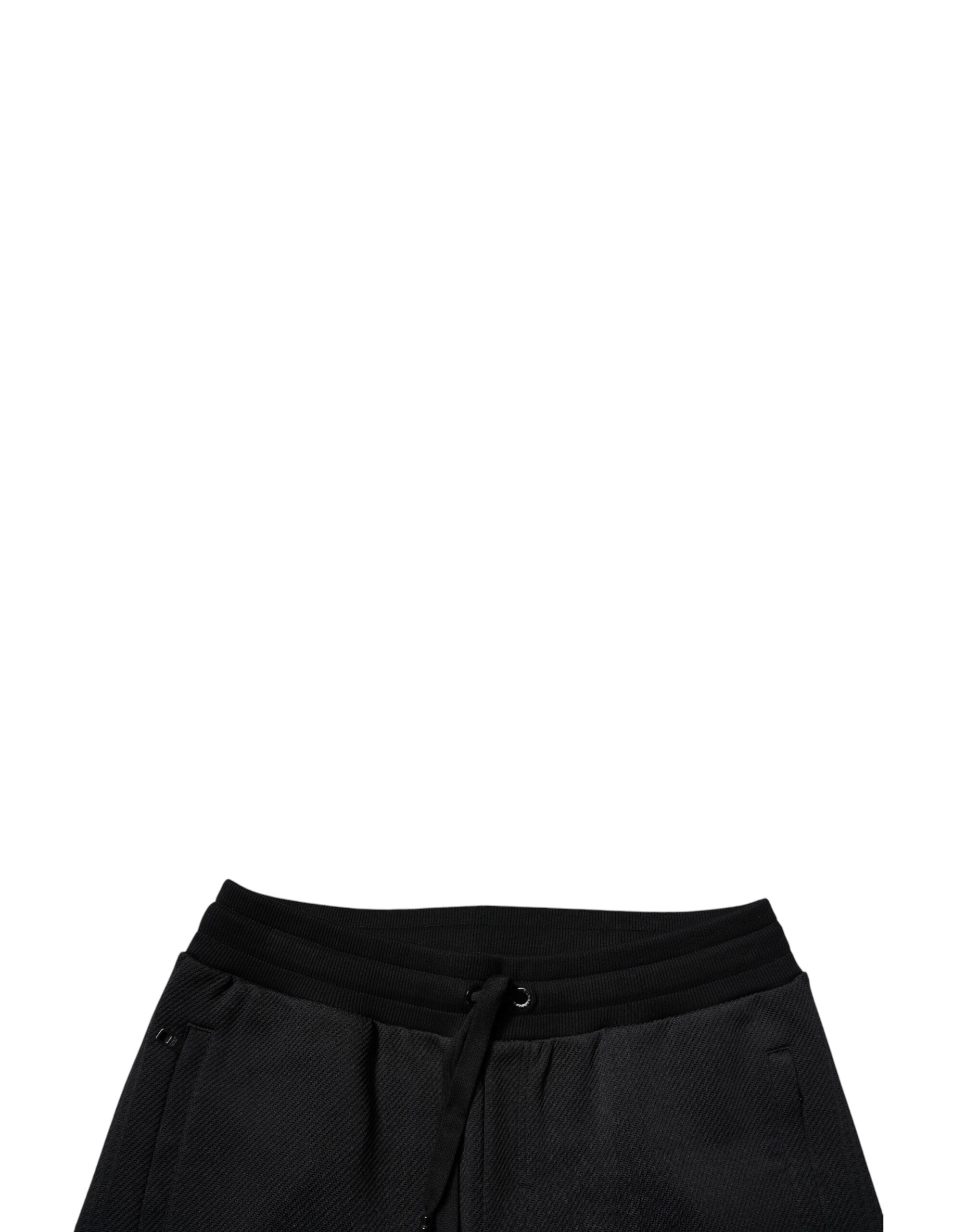 Pantalon jogging pour homme Dolce & Gabbana en polyester noir, style décontracté avec ceinture élastique et poches latérales.