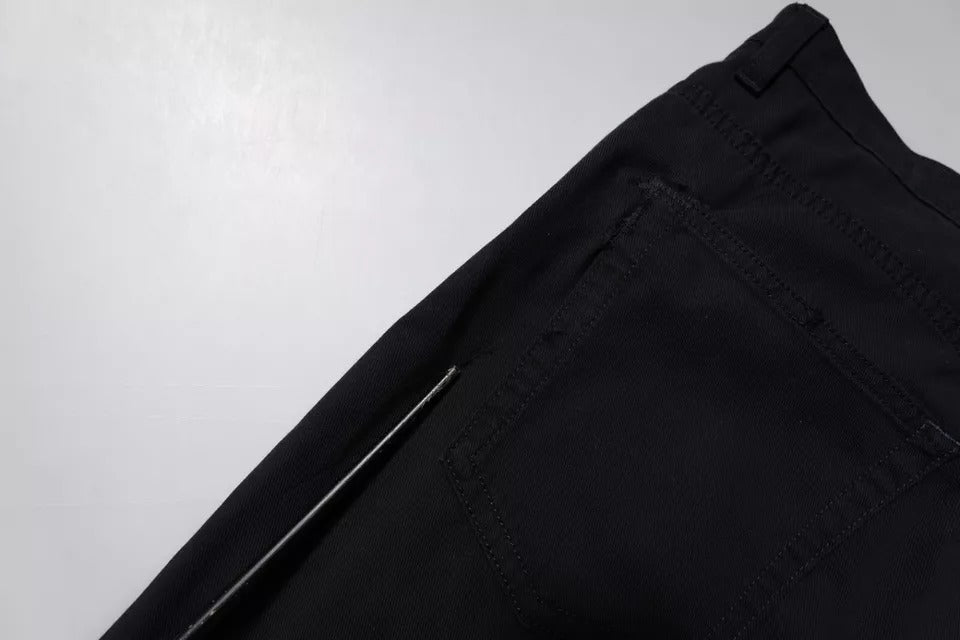 Jean homme en denim bleu foncé en coton stretch de Dolce & Gabbana, coupe ample et décontractée.