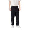 Pantalon décontracté en polyester noir de la marque Calvin Klein Jeans, coupe confortable et style casual.