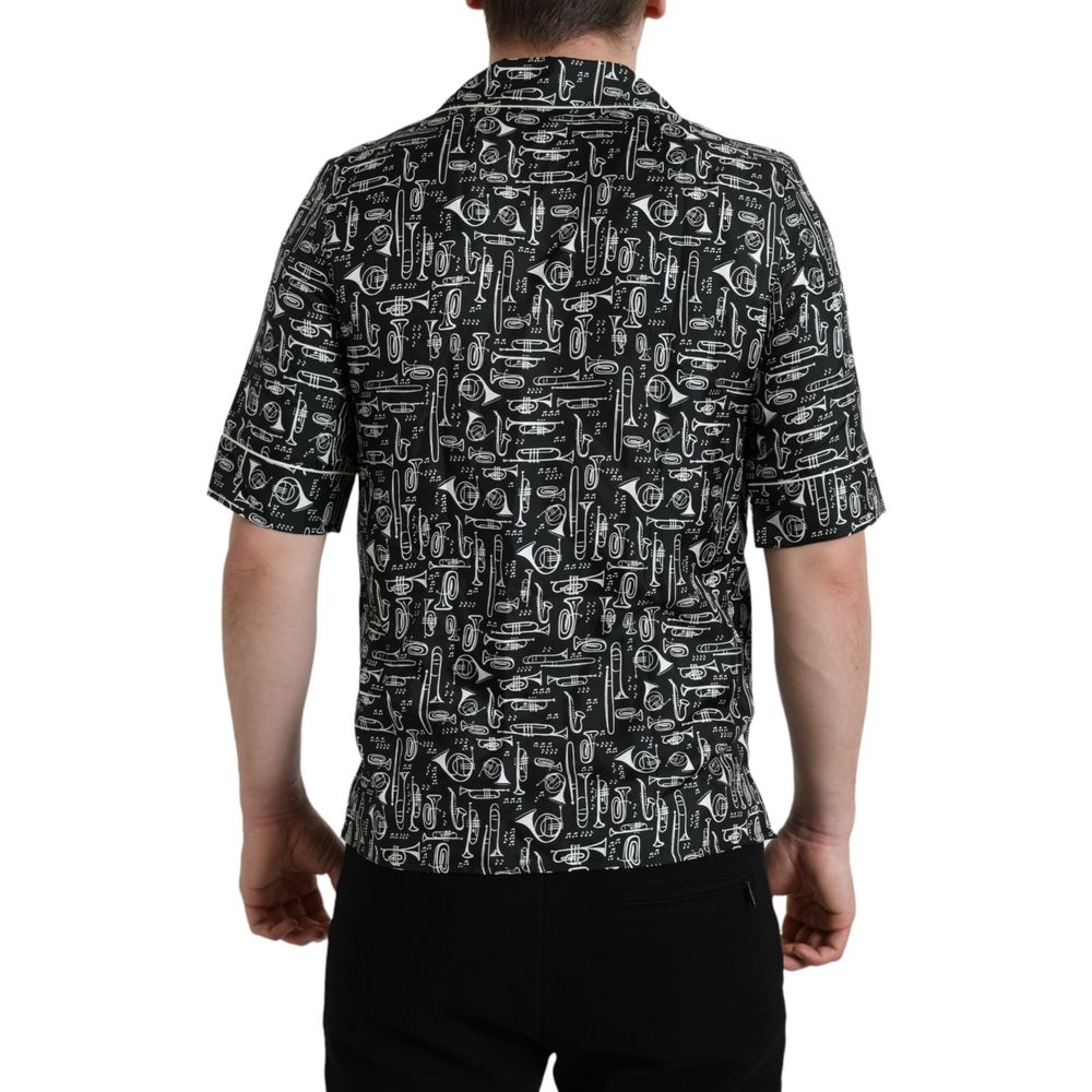 Chemise noire en soie Dolce & Gabbana à manches courtes, élégante et légère, pour un style sophistiqué.
