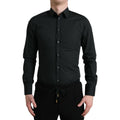 Chemise noire en coton de la marque Dolce & Gabbana, élégante et classique, visible en détail sur cette image.