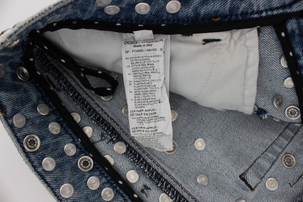 Jeans Dolce & Gabbana avec embellissements de roses en cristaux et motif en forme de cœur, détails élégants et sophistiqués.