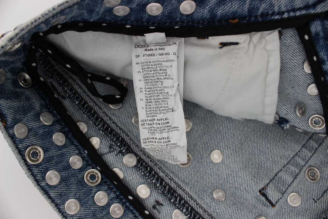Jeans Dolce & Gabbana avec embellissements de roses en cristaux et motif en forme de cœur, détails élégants et sophistiqués.
