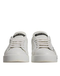 Chaussures sneakers Portofino blanches et bleues Dolce & Gabbana avec logo, vue de face sur fond neutre.
