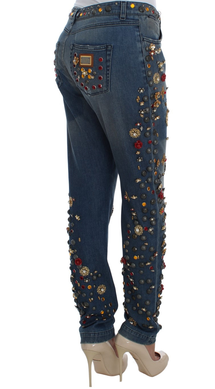 Jeans Dolce & Gabbana avec décor en cristaux en forme de roses et motif cœur, mode élégante et sophistiquée.