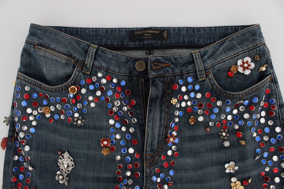 Jeans Dolce & Gabbana avec embellissements en cristaux en forme de roses et motif cœur, mode élégante et raffinée.