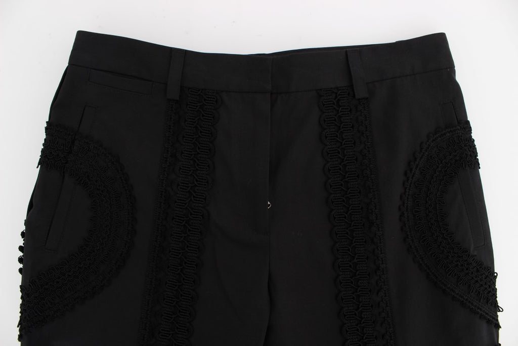 Pantalons capris noirs en coton stretch Dolce & Gabbana avec motif torero, coupe ajustée, vue de face.