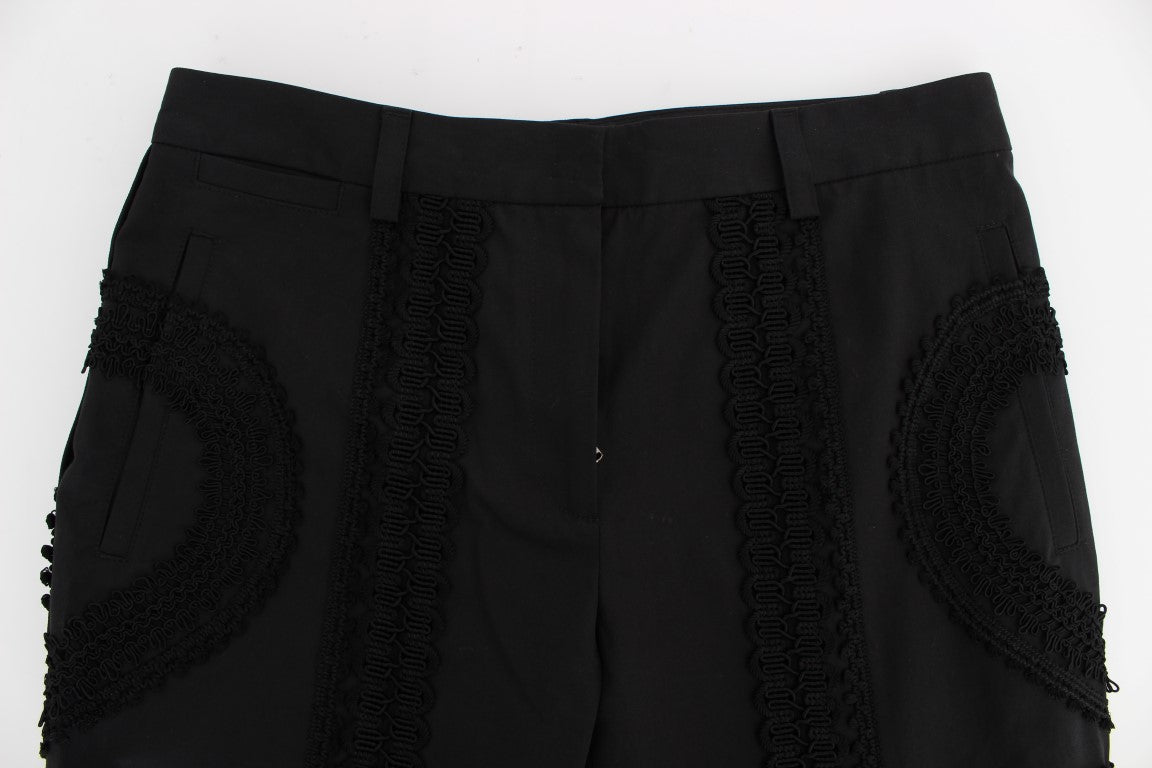 Pantalons capris noirs en coton stretch Dolce & Gabbana avec motif torero, coupe ajustée, vue de face.