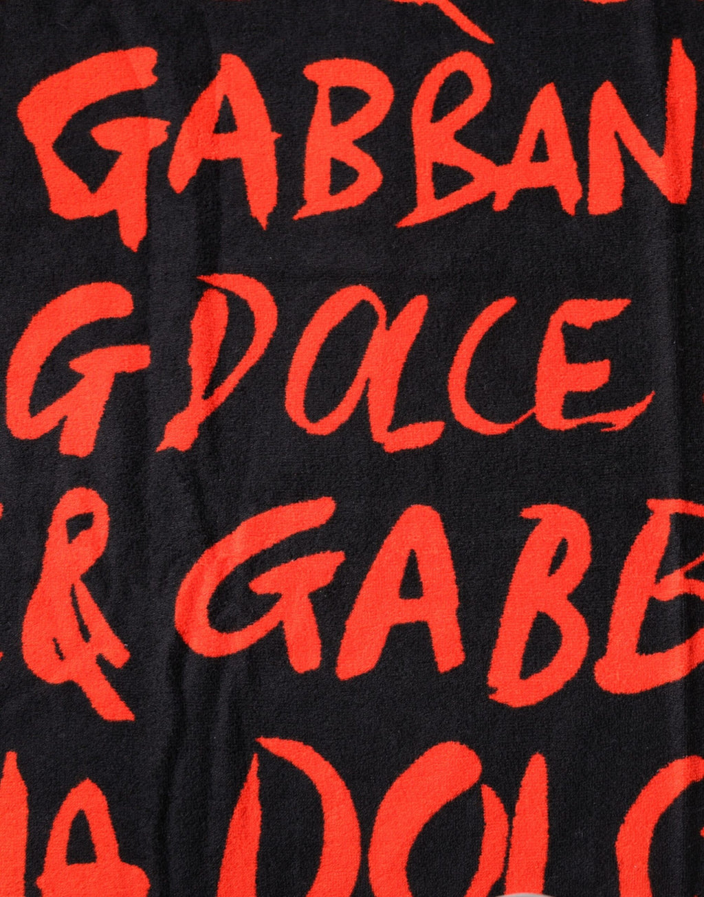 Serviette de plage en coton noir et rouge Dolce & Gabbana avec logo imprimé, idéale pour la plage ou la piscine.