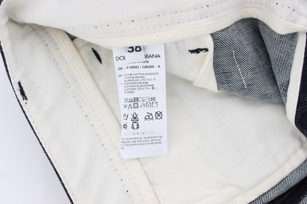 Jeans capri slim à pois Dolce & Gabbana, en denim bleu avec motifs à pois noirs, ajustés et tendance.