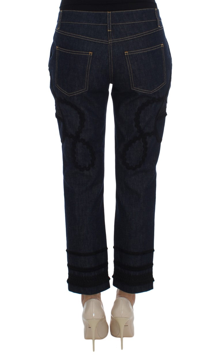 Jean Capri Dolce & Gabbana en denim bleu et coton avec motif torero, coupe ajustée et style chic.