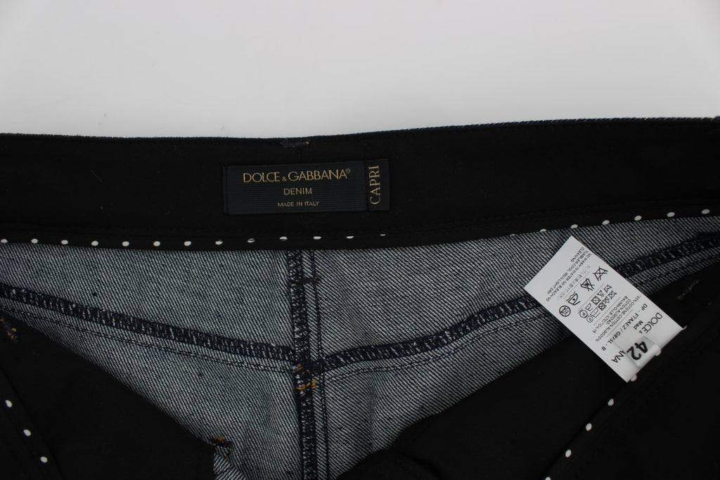 Jeans Capri en denim bleu en coton Dolce & Gabbana avec coupe torero, visibles sur l'image.