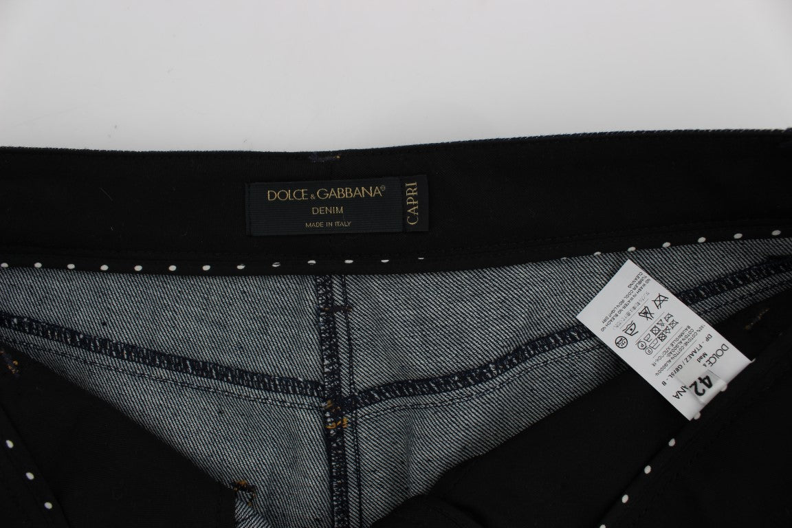 Jeans Capri en denim bleu en coton Dolce & Gabbana avec coupe torero, visibles sur l'image.