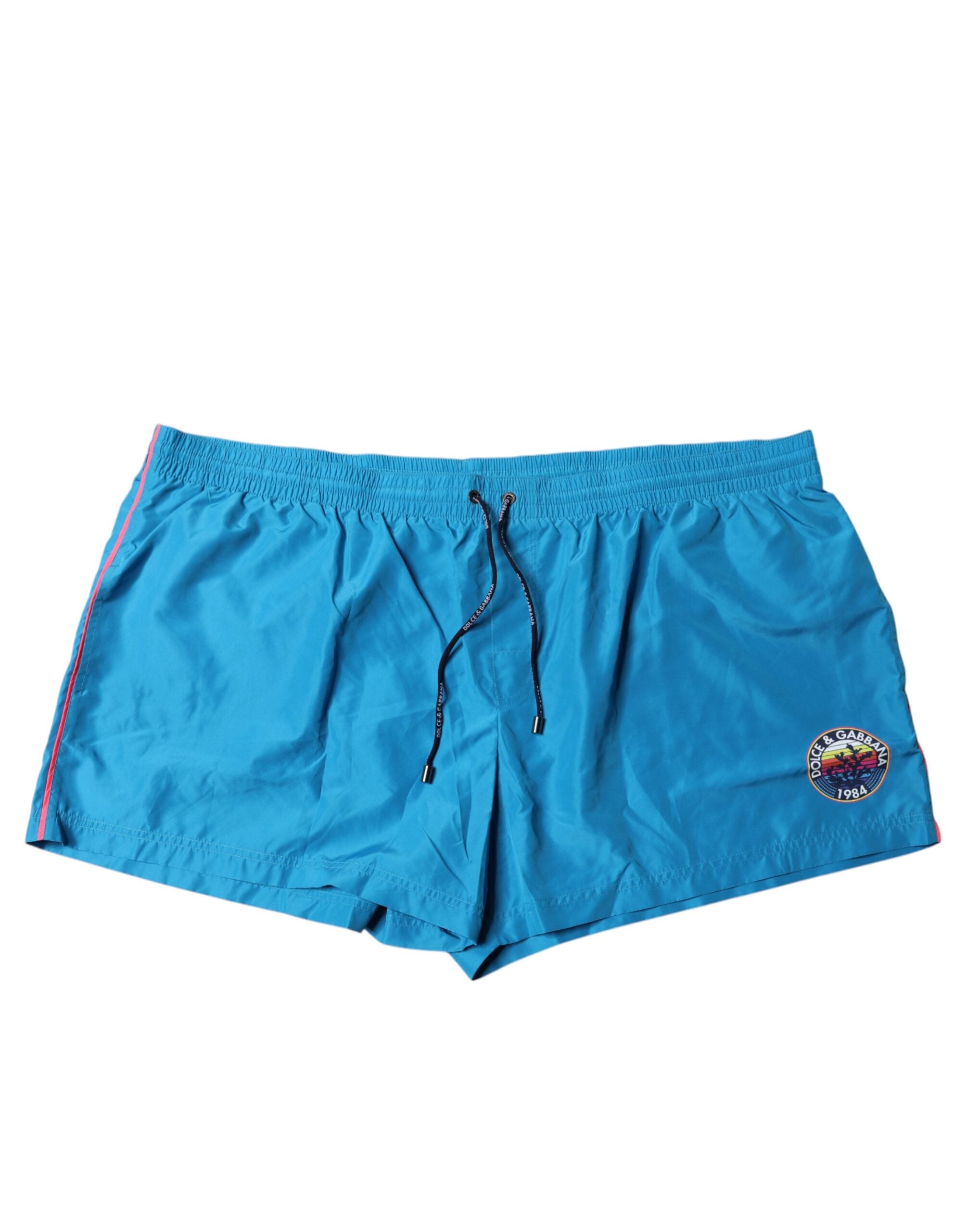 Shorts de bain 2 pièces Dolce & Gabbana turquoise avec logo, vue de face, tissu léger et design élégant pour la plage.