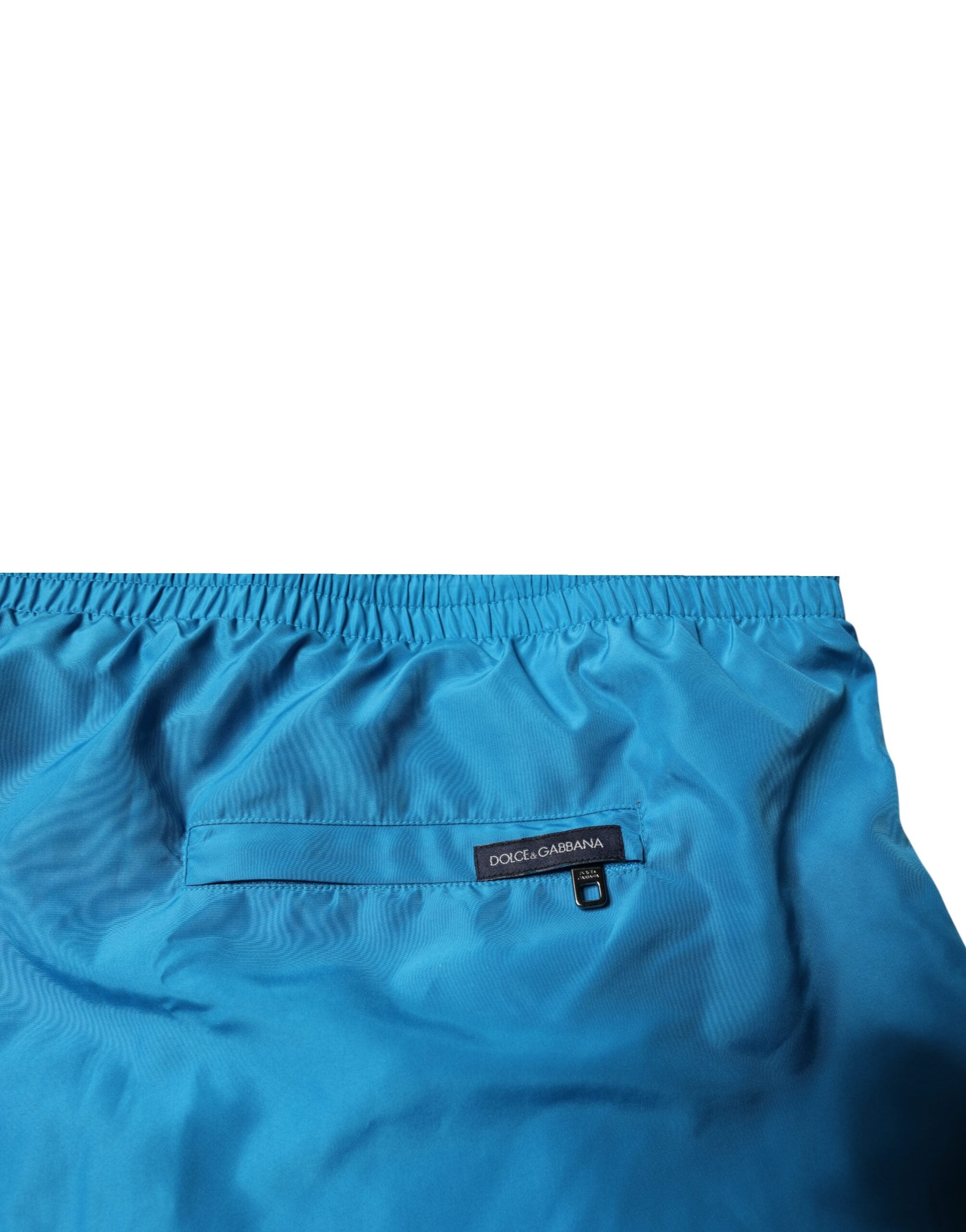 Shorts de bain deux pièces Dolce & Gabbana en turquoise avec logo, parfaits pour la plage, mode élégante et confortable.