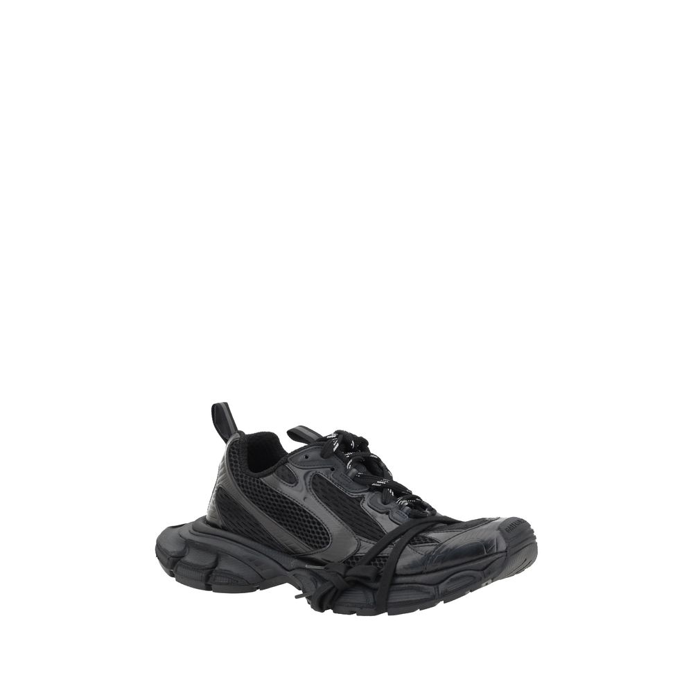 Sneakers balenciaga noires en polyéthylène pour sport, avec semelle blanche et design moderne.