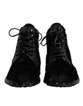 Bottes mi-mollet en cuir noir style pony de Dolce & Gabbana, chaussures élégantes avec finition sophistiquée.