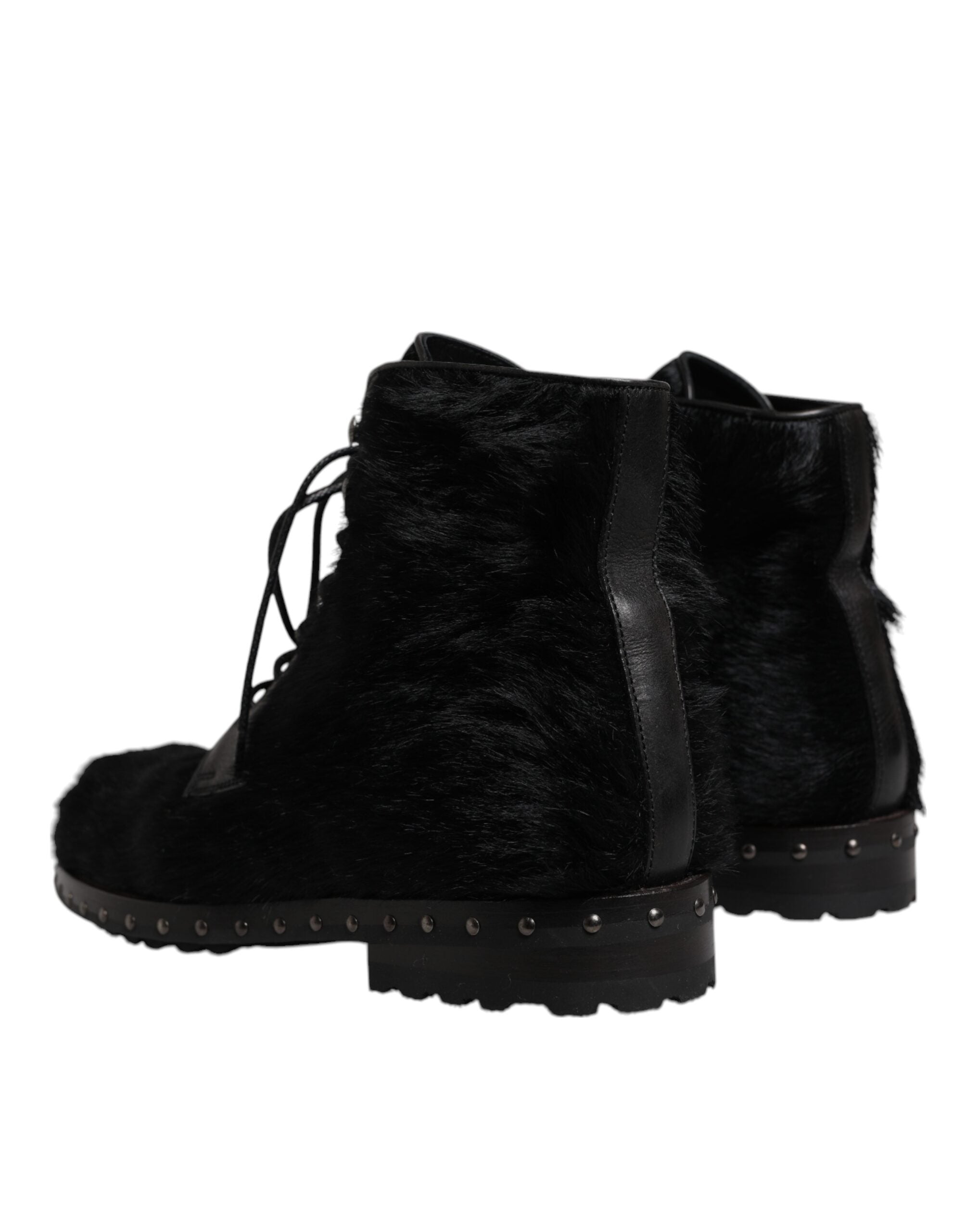 Bottes mi-mollet en cuir noir style pony de Dolce & Gabbana, chaussures élégantes avec finition sophistiquée.
