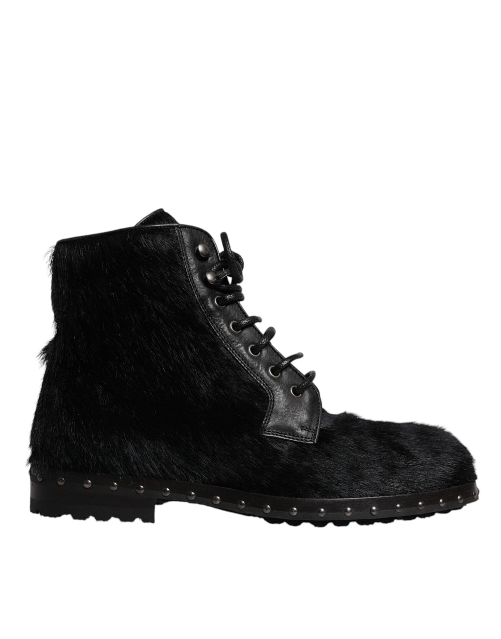 Bottes en cuir noir de style pony mi-mollet de la marque Dolce & Gabbana, visibles en détail sur l'image.
