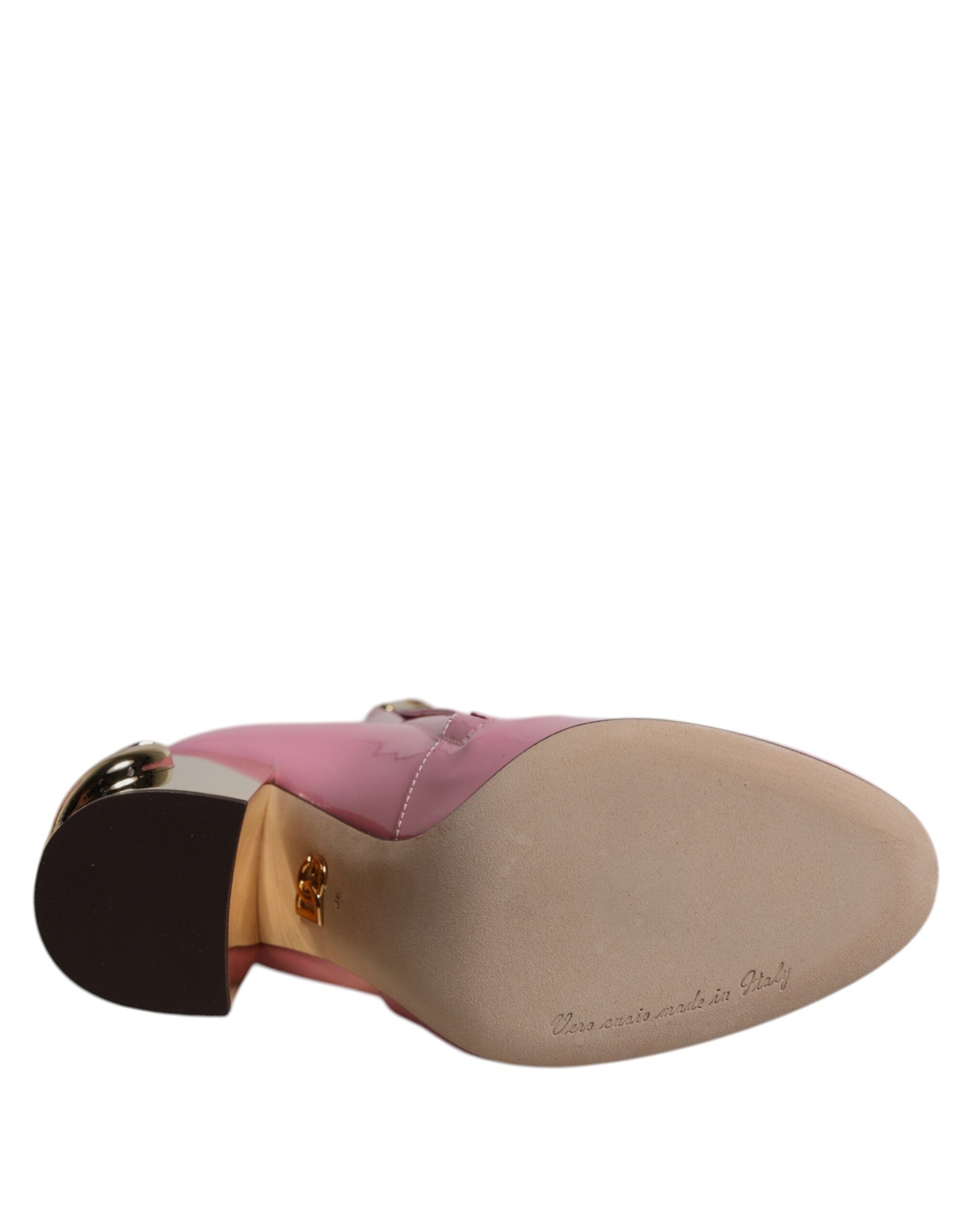 Bottes Dolce & Gabbana en cuir verni rose, talons mi-mollet, chaussures élégantes avec finition brillante.