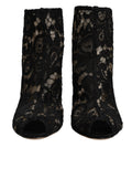 Chaussures à talons noires Dolce & Gabbana, bottines en dentelle florale, avec talon et fermeture à laçage.