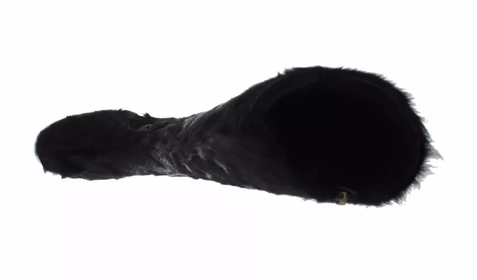 Bottes en cuir et fourrure d'agneau noire de Dolce & Gabbana, style élégant avec détails sophistiqués.