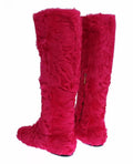 Bottes plates en cuir et fourrure d'agneau rose de Dolce & Gabbana, chaussures élégantes avec finition raffinée.