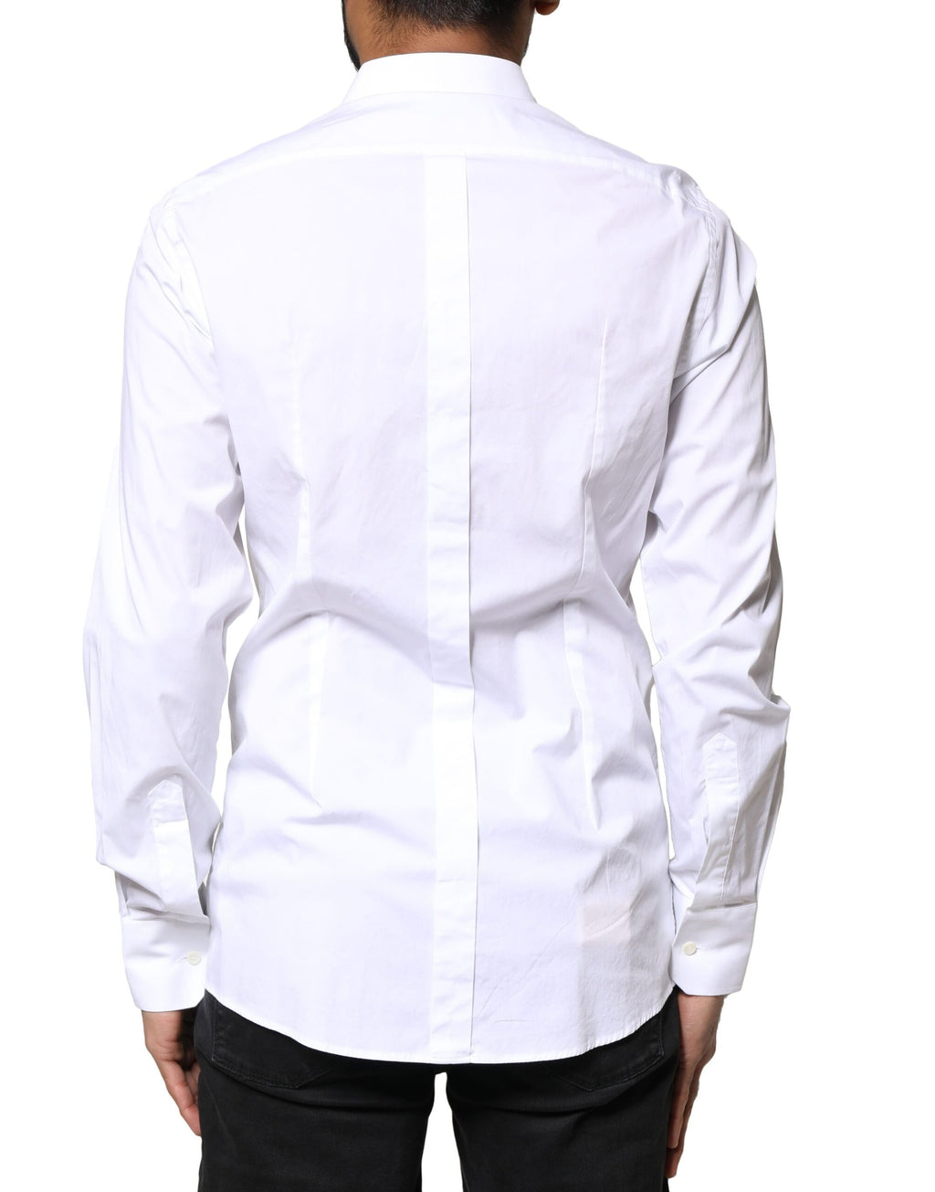 Chemise longue blanche Dolce & Gabbana en coton à manches longues avec détails dorés visibles sur l'image.