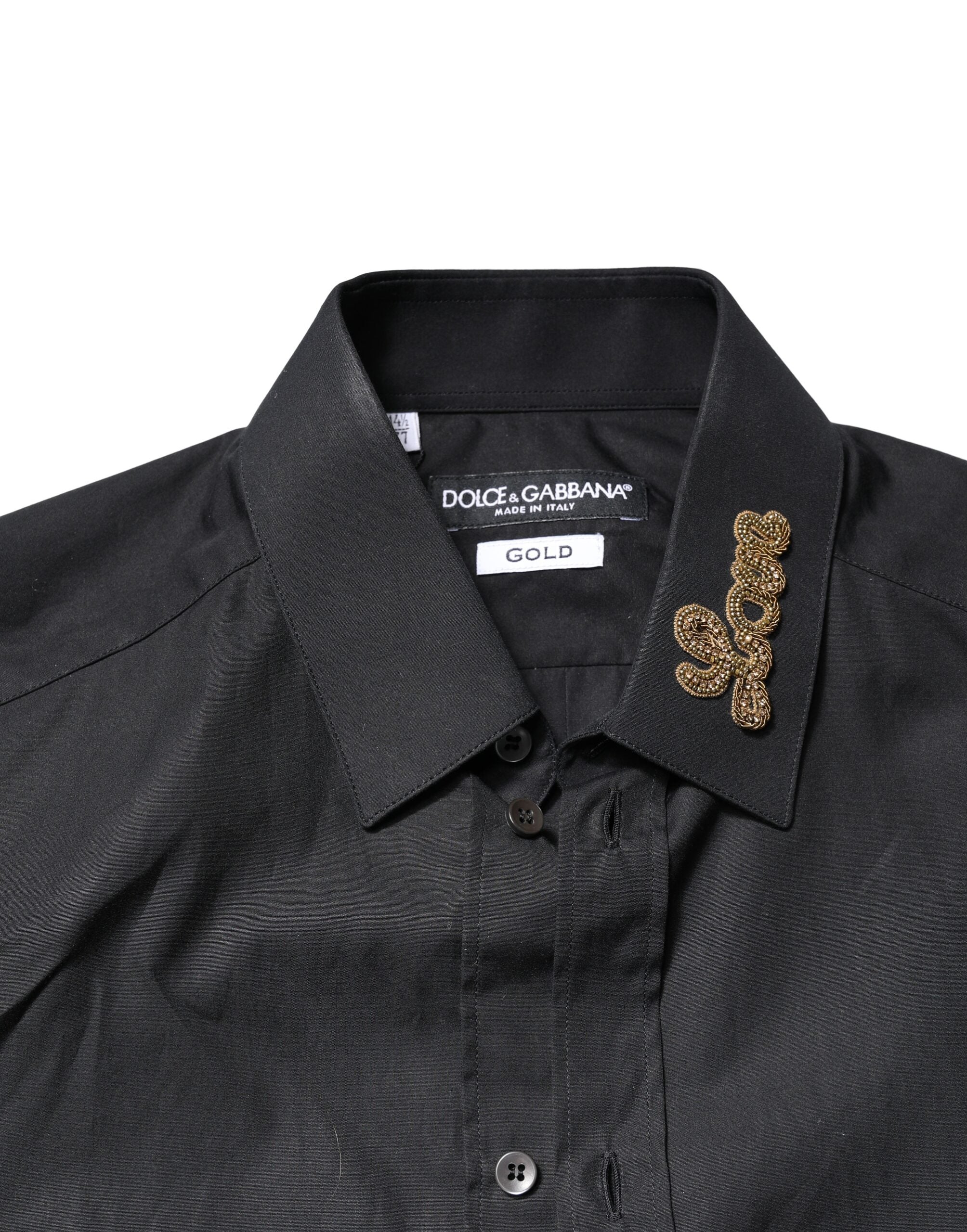 Chemise formelle noire Dolce & Gabbana avec broderie Love dorée, détails élégants et design sophistiqué visible sur l'image.