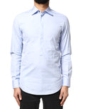 Chemise longue en coton Dolce & Gabbana Light Blue avec manches longues, vue de face sur un fond neutre.