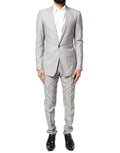 Costume formel en laine gris clair Dolce & Gabbana, ensemble 2 pièces avec détails dorés pour homme.
