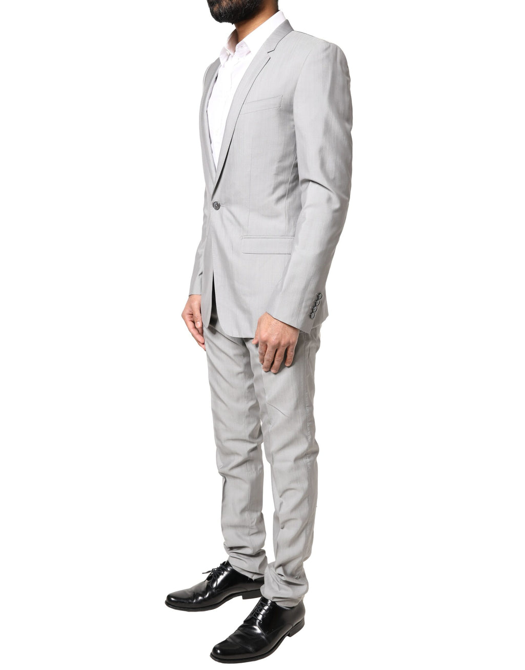 Costume formel en laine gris clair Dolce & Gabbana, ensemble deux pièces avec détails dorés, élégance sophistiquée.