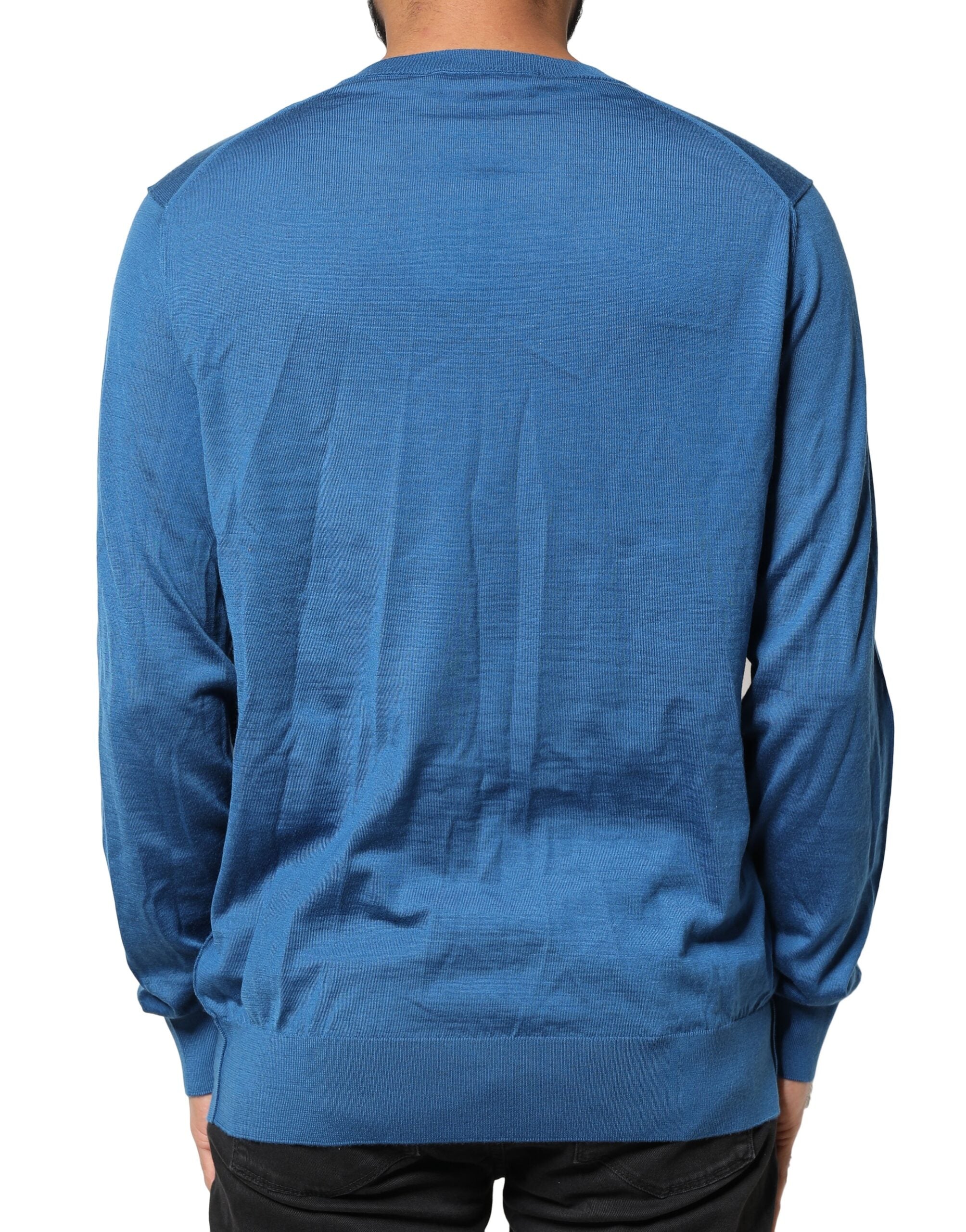 Pull en cachemire bleu Dolce & Gabbana à col en V avec motif couronne, élégant et doux, pour un style sophistiqué.