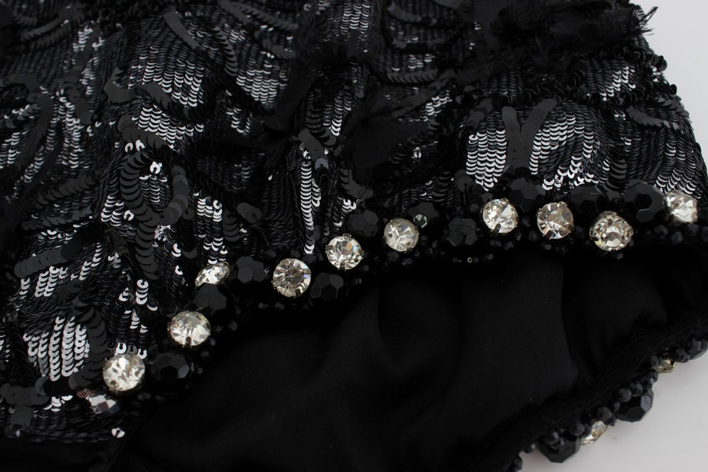 Mini shorts noirs Dolce & Gabbana ornés de cristaux et paillettes, avec un style élégant et brillant.