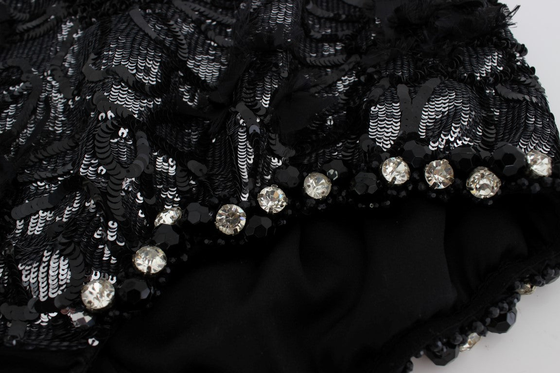 Mini shorts noirs Dolce & Gabbana ornés de cristaux et paillettes, avec un style élégant et brillant.