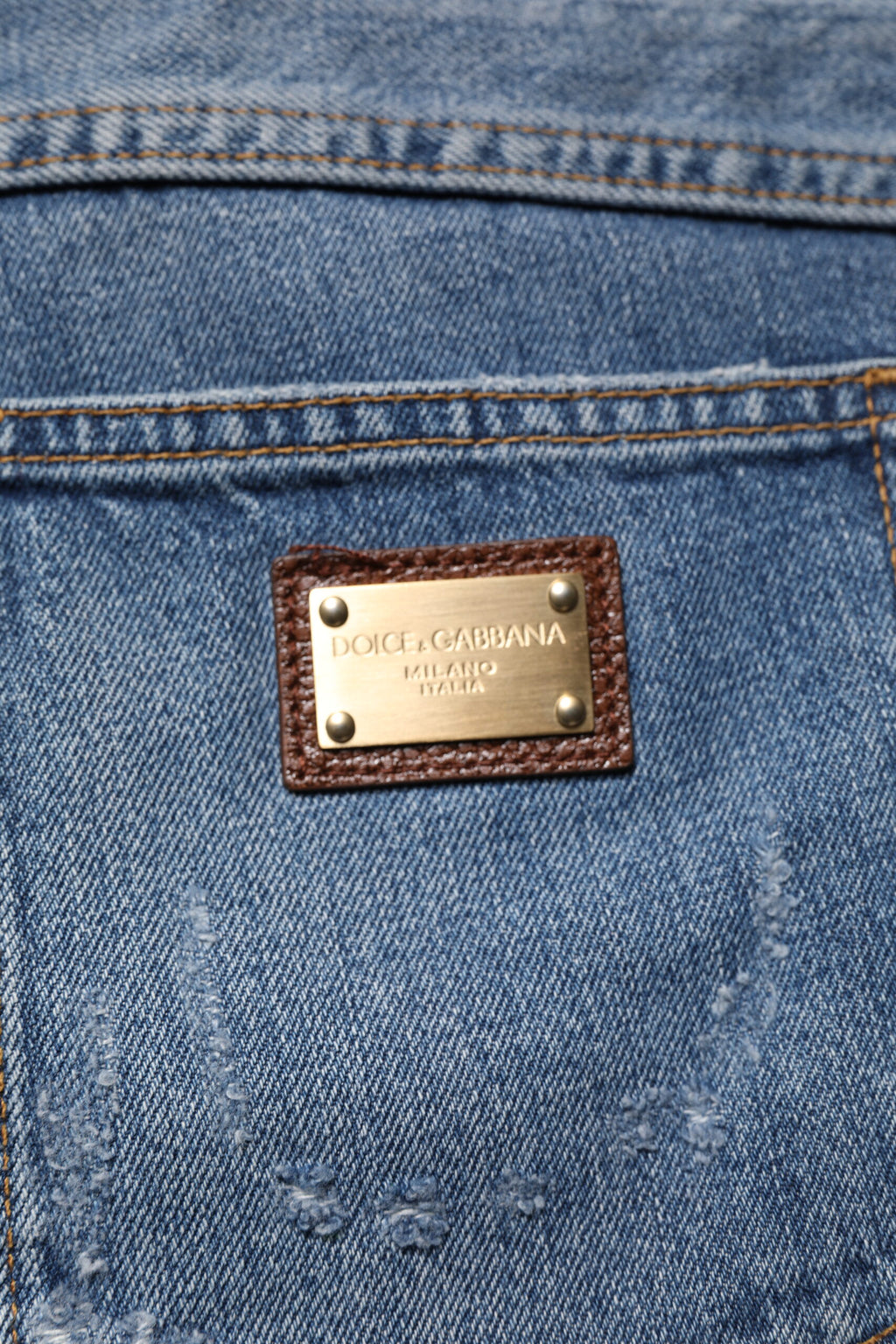 Jeans en denim blanc cassé Dolce & Gabbana, coupe droite, avec déchirures et style usé, en coton tissé léger.