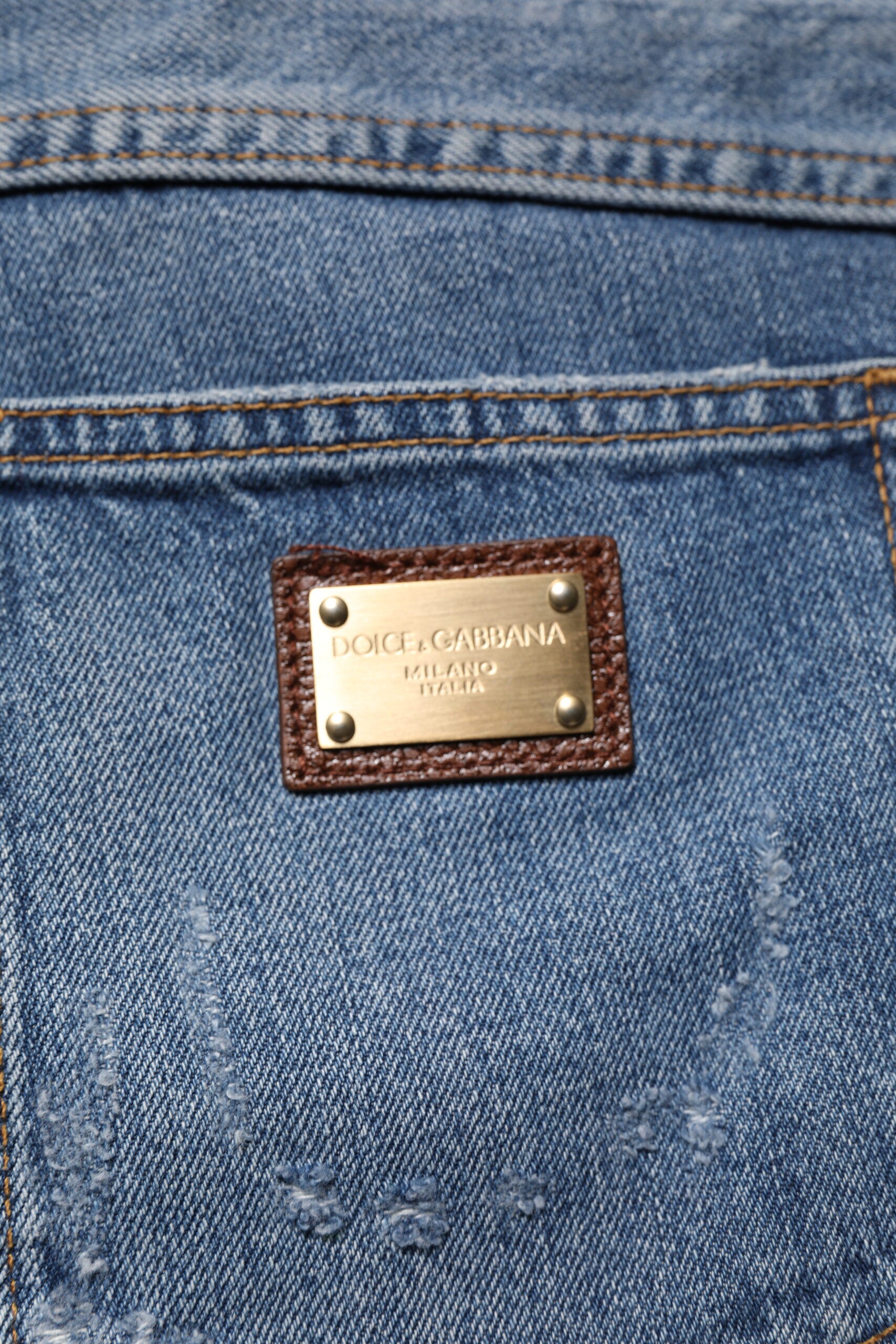 Jeans en denim blanc cassé Dolce & Gabbana, coupe droite, avec déchirures et style usé, en coton tissé léger.