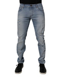 Jeans skinny en denim coton déchiré bleu de Dolce & Gabbana pour homme, coupe ajustée et détails usés.
