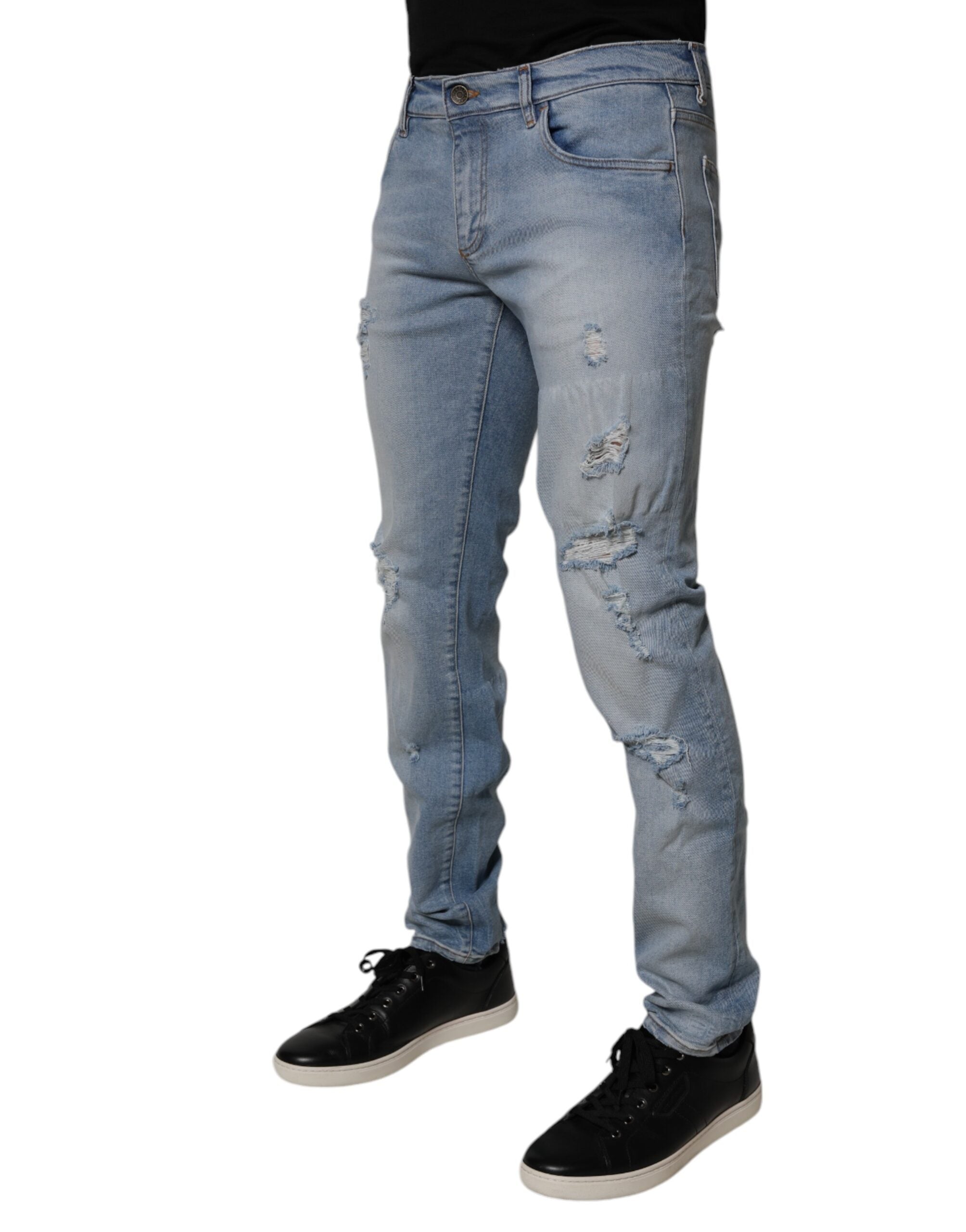 Jeans homme skinny en denim coton bleu déchiré de Dolce & Gabbana, style tendance et coupe ajustée.