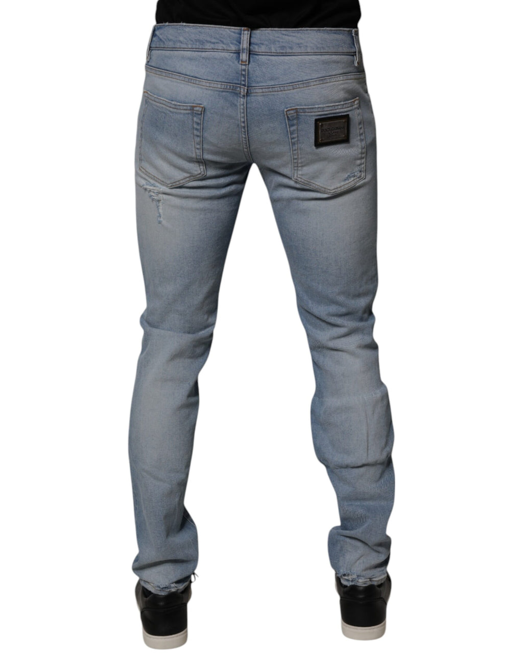 Jeans skinny en denim déchiré en coton bleu de Dolce & Gabbana pour homme, style tendance et moderne.