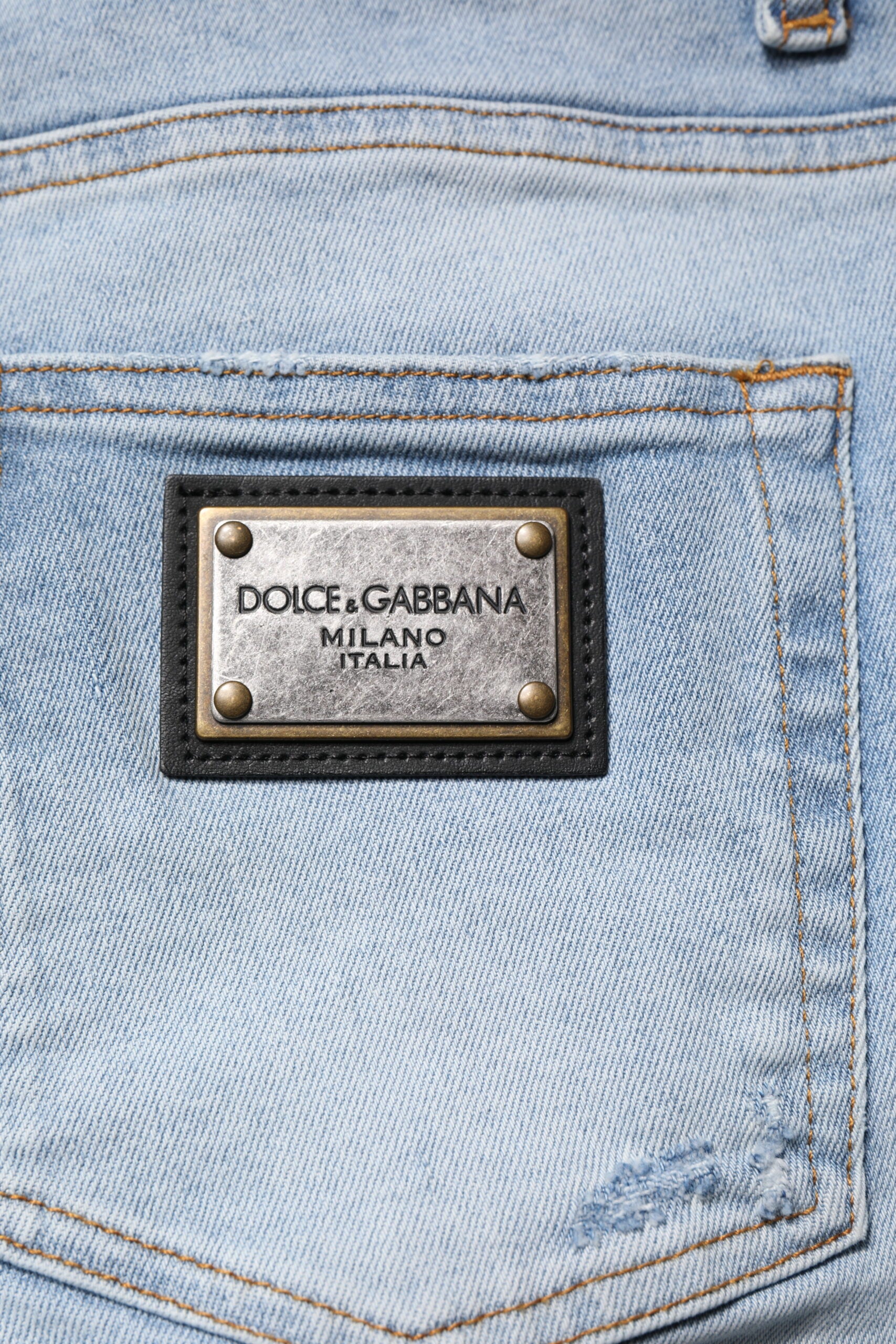 Jeans homme en denim skinny bleu déchiré de Dolce & Gabbana, coton, style décontracté et tendance.