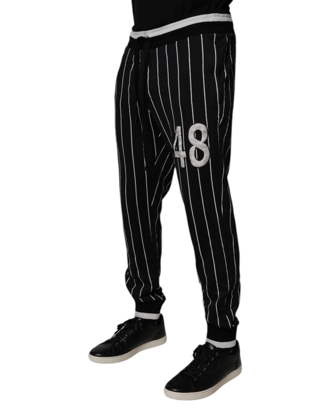 Pantalon de jogging Dolce & Gabbana à rayures noires et blanches, confort et style décontracté pour homme.