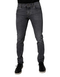 Jeans skinny en denim gris foncé en coton stretch de Dolce & Gabbana, vue de face avec détails de couture.
