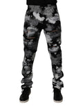 Jeans skinny en denim camouflage multicolore déchiré de Dolce & Gabbana, style tendance et design unique.
