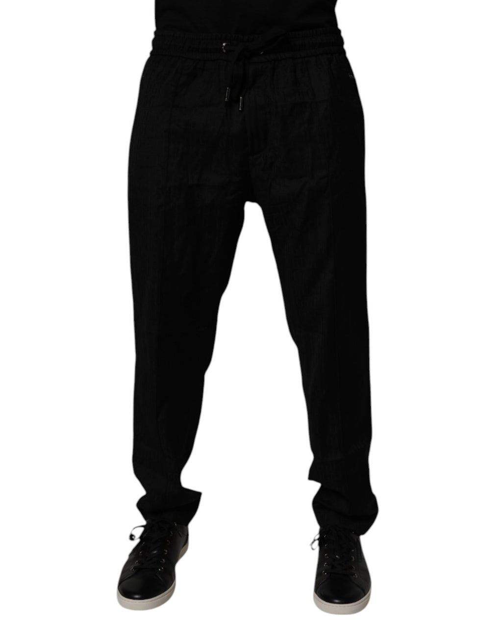 Pantalon de jogging en laine noire Dolce & Gabbana, coupe décontractée avec ourlets côtelés et logo discret sur la jambe.