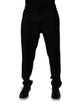 Pantalon de jogging en laine noire Dolce & Gabbana, coupe décontractée avec ourlets côtelés et logo discret sur la jambe.