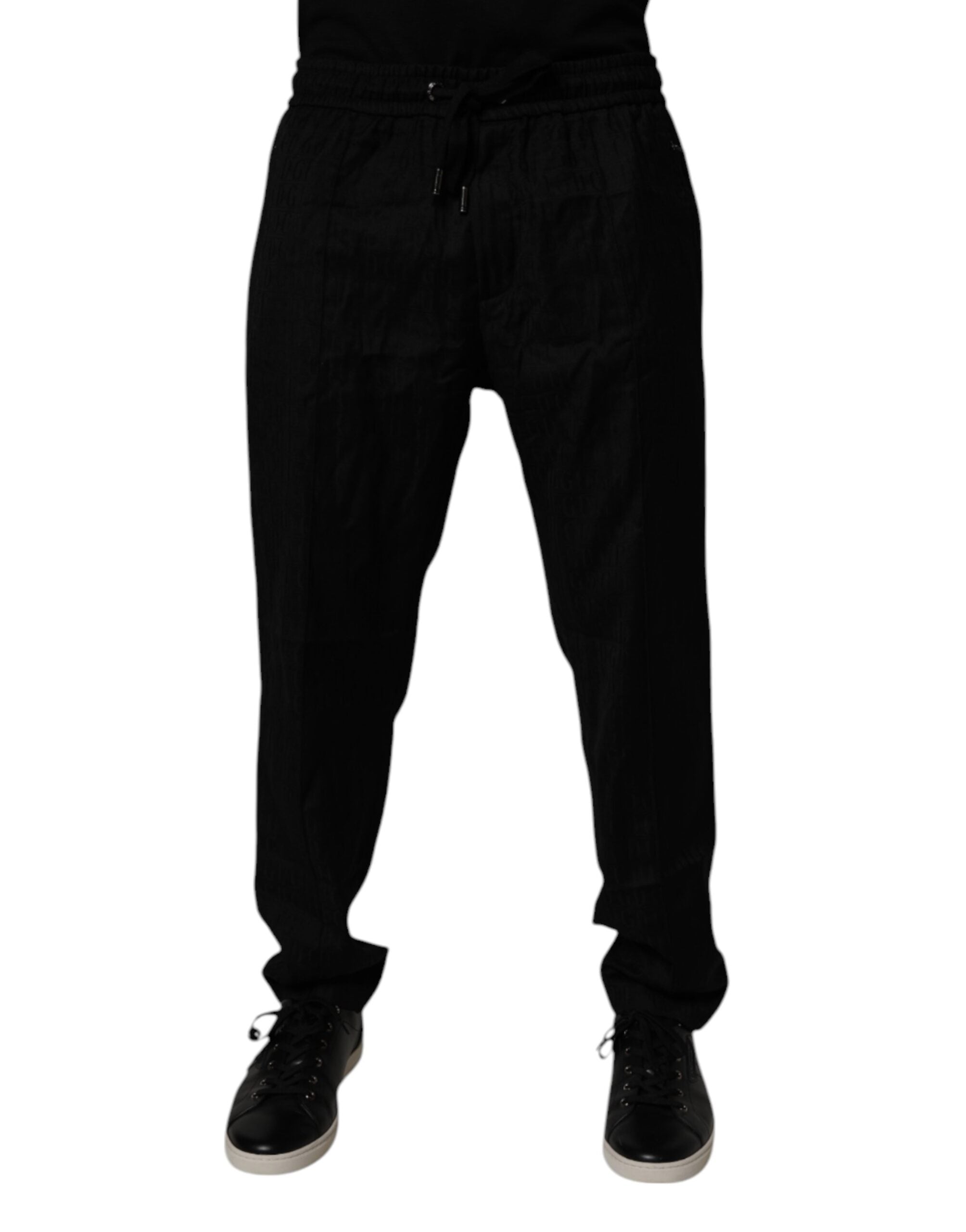 Pantalon de jogging en laine noire Dolce & Gabbana, coupe décontractée avec ourlets côtelés et logo discret sur la jambe.