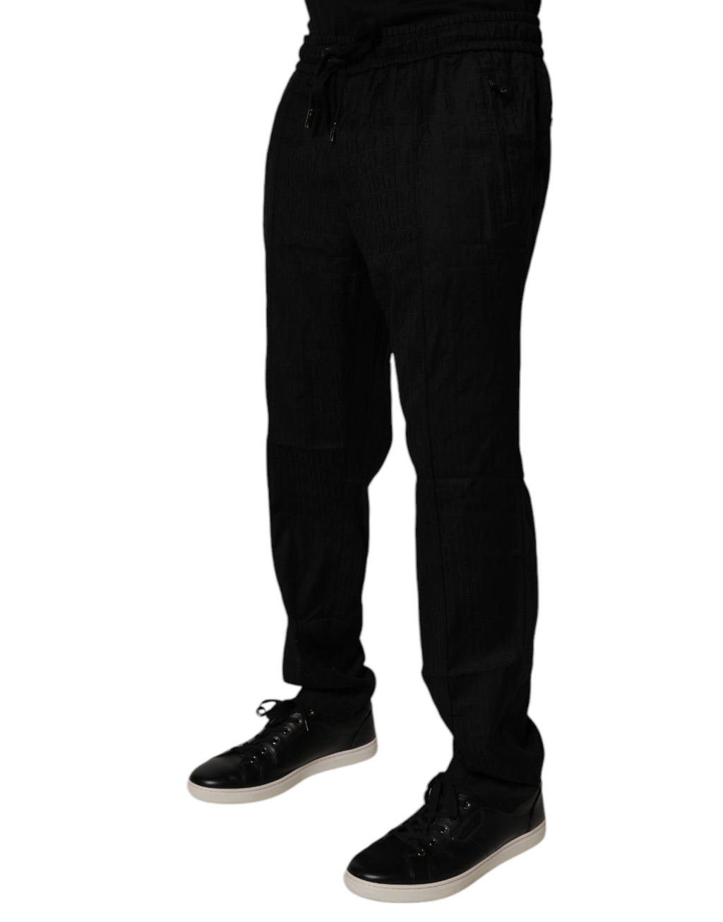 Pantalon de jogging en laine noire Dolce & Gabbana, style décontracté, ajusté avec élastiques à la taille et aux chevilles.