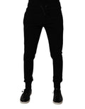 Pantalons joggers Dolce & Gabbana en coton noir avec ceinture élastique et poches, style décontracté et confortable.
