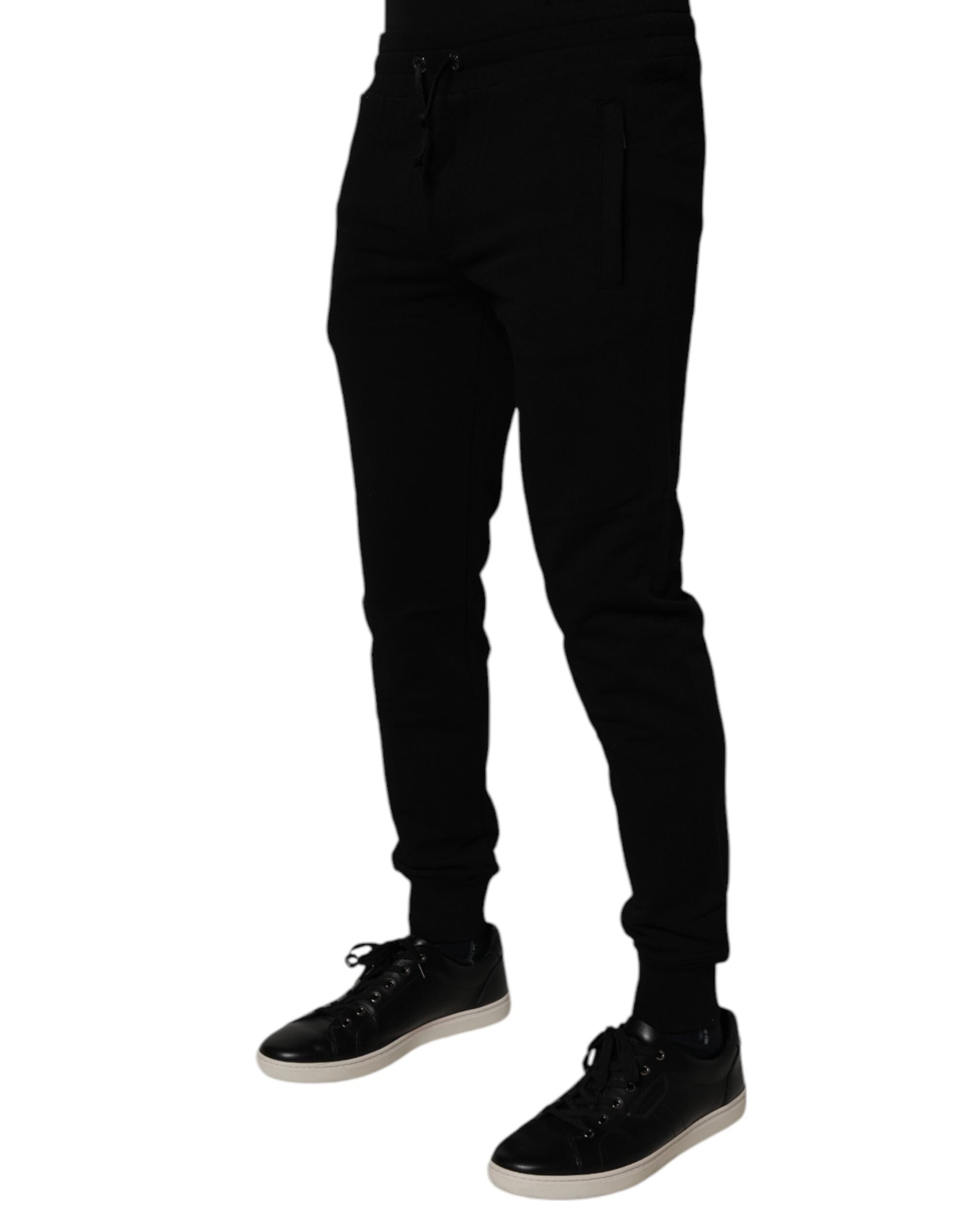 Pantalon jogging Dolce & Gabbana en coton noir, style décontracté, avec cordons de serrage et poches latérales.